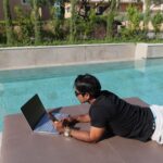 Fernando-Raymond-Working-by-the-Pool-in-Thalassa-Hotel-in-Kefalonia-Island-as-a-Digital-Nomad