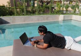 Fernando-Raymond-Working-by-the-Pool-in-Thalassa-Hotel-in-Kefalonia-Island-as-a-Digital-Nomad