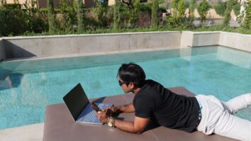 Fernando-Raymond-Working-by-the-Pool-in-Thalassa-Hotel-in-Kefalonia-Island-as-a-Digital-Nomad