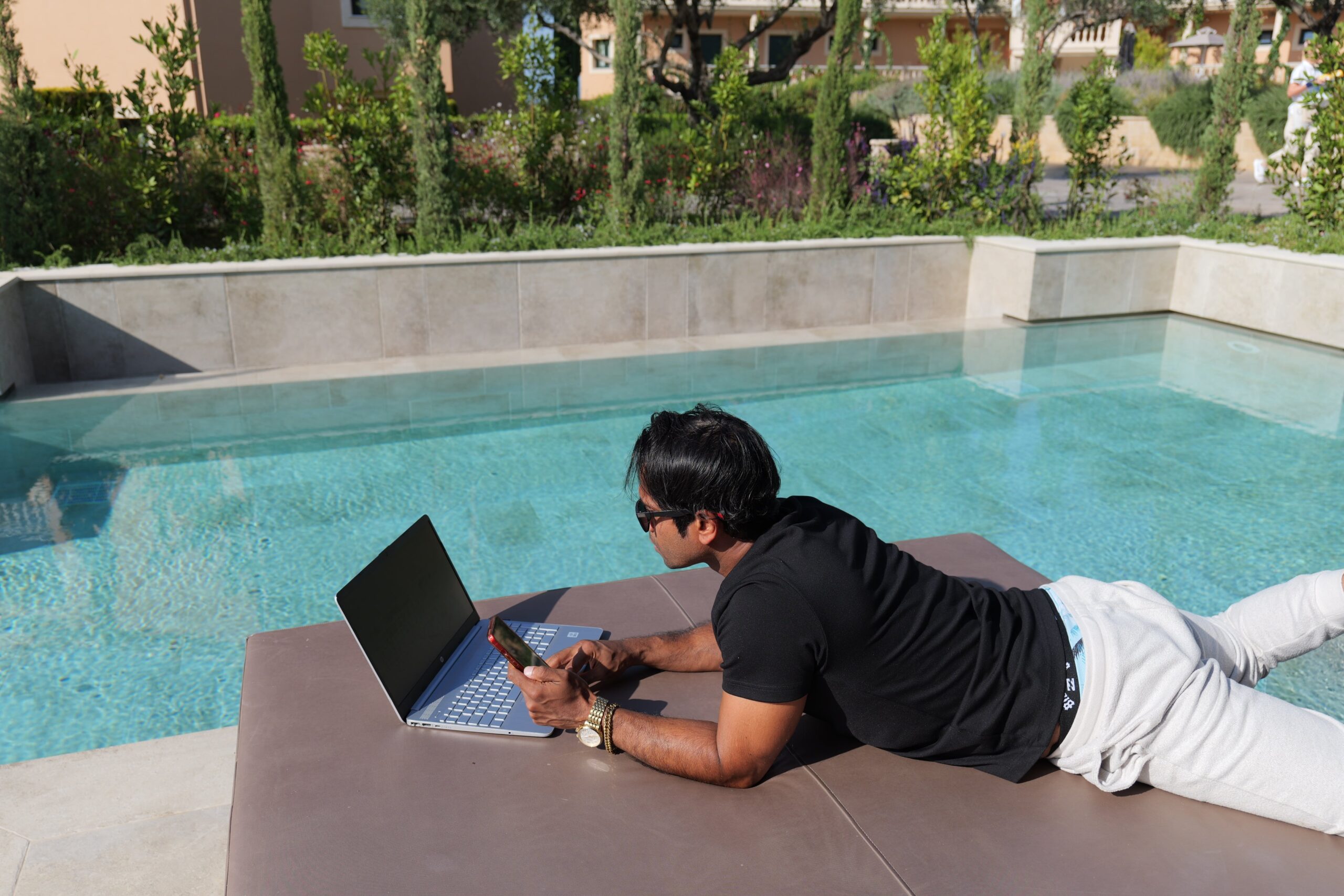 Fernando-Raymond-Working-by-the-Pool-in-Thalassa-Hotel-in-Kefalonia-Island-as-a-Digital-Nomad