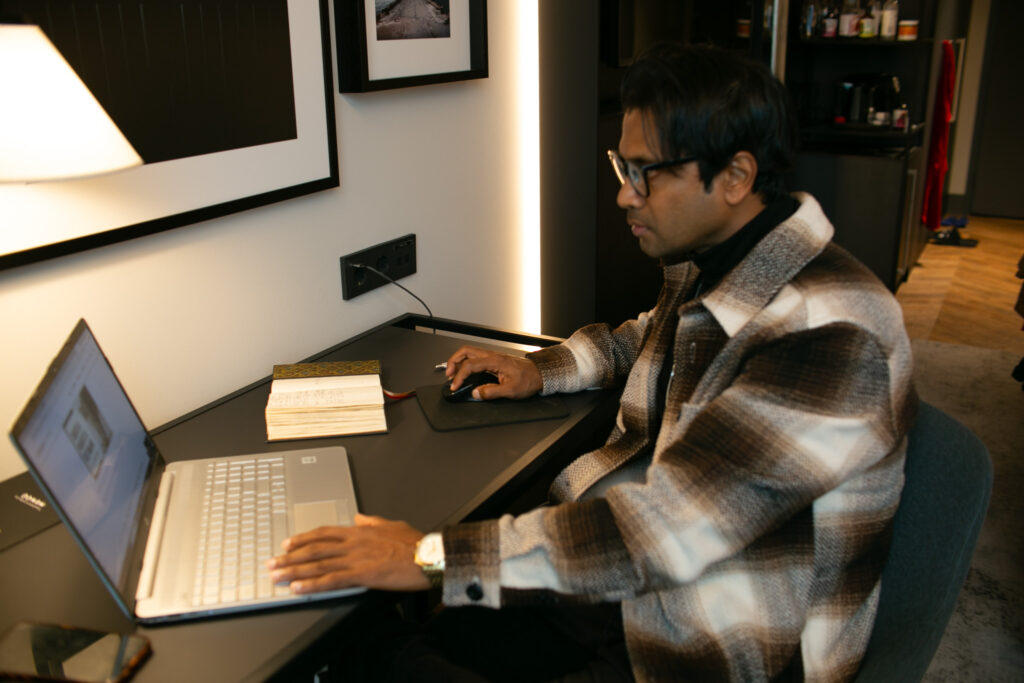 Fernando-Raymond-Working-on-his-Laptop-from-Radisson-Collection-Hotel-in-Tallinn-Estonia