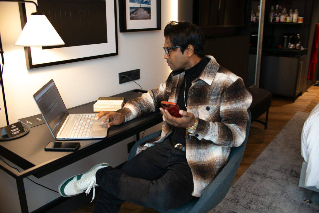 Fernando-Raymond-Working-on-his-Laptop-from-Radisson-Collection-Hotel-in-Tallinn-Estonia